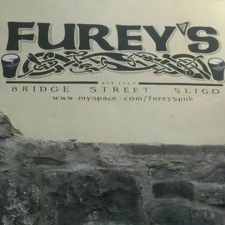 Furey's Bridge Street Sligo painted wall sign with Celtic knotwork