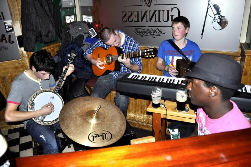 Live music session with banjo, guitars, keyboard and drums at Furey's